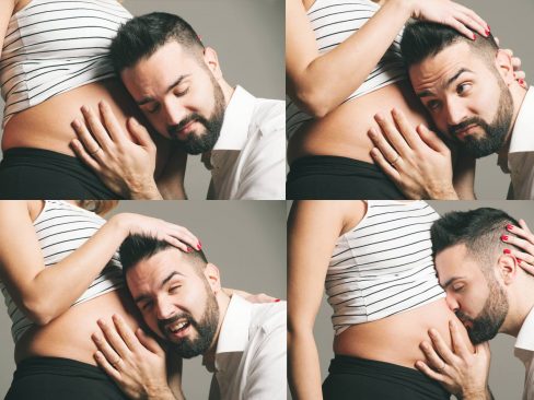 papà che ascolta e bacia il figlio nel pancione